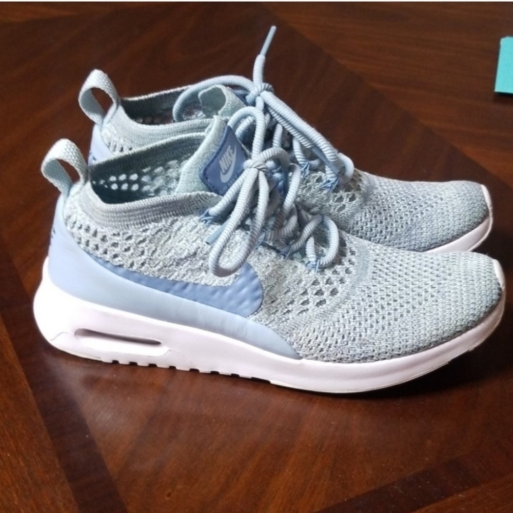 Good used condition. Nike thea flyknit light blue